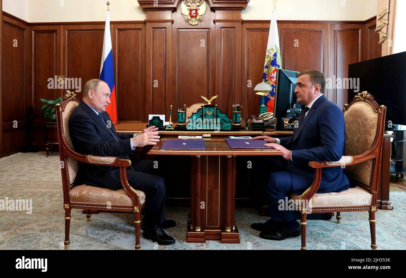 Moscow, Russia. 14th July, 2022. Russian President Vladimir Putin holds a face-to-face meeting with the Governor of the Tula Region Alexei Dyumin, right, to discuss the economic situation in the Republic, at the Kremlin, July 14, 2022 in Moscow, Russia. Credit: Mikhail Klimentyev/Kremlin Pool/Alamy Live News Stock Photo