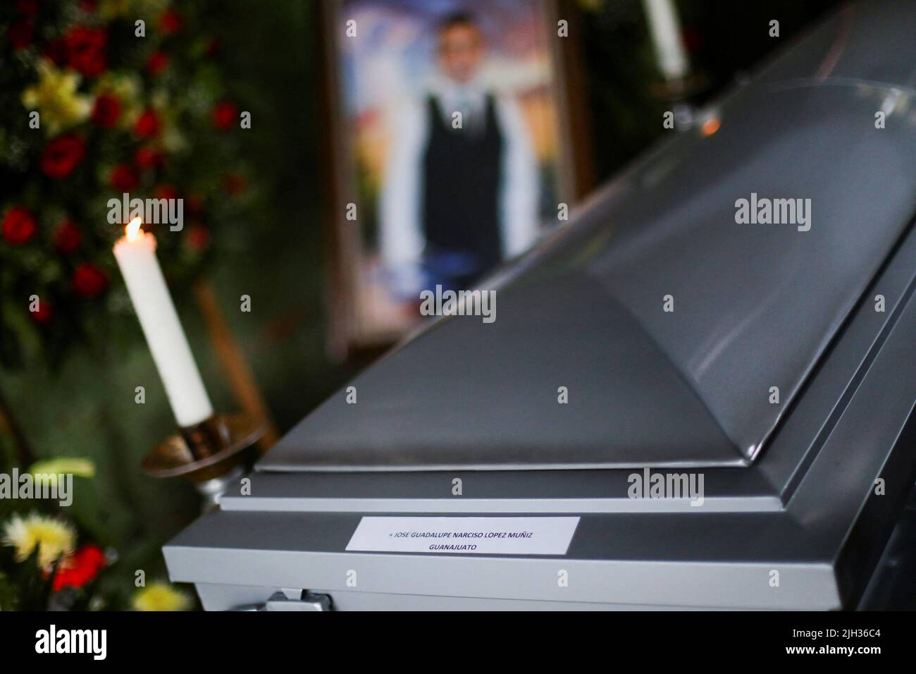 The name of late migrant Jose Lopez, 34, is written on his coffin during his wake after being repatriated from San Antonio, Texas, U.S., at his family's home in Celaya, in Guanajuato state, Mexico July 14, 2022. REUTERS/Edgard Garrido Stock Photo