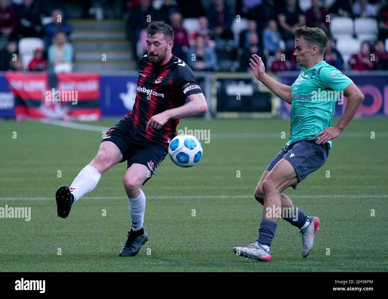 Crusaders’ Joseph William Burns battles with Magpies’ Jamie Coombes during the UEFA Europa Conference League First Qualifying Round second leg match at Seaview, Belfast. Picture date: Thursday July 14, 2022. Stock Photo