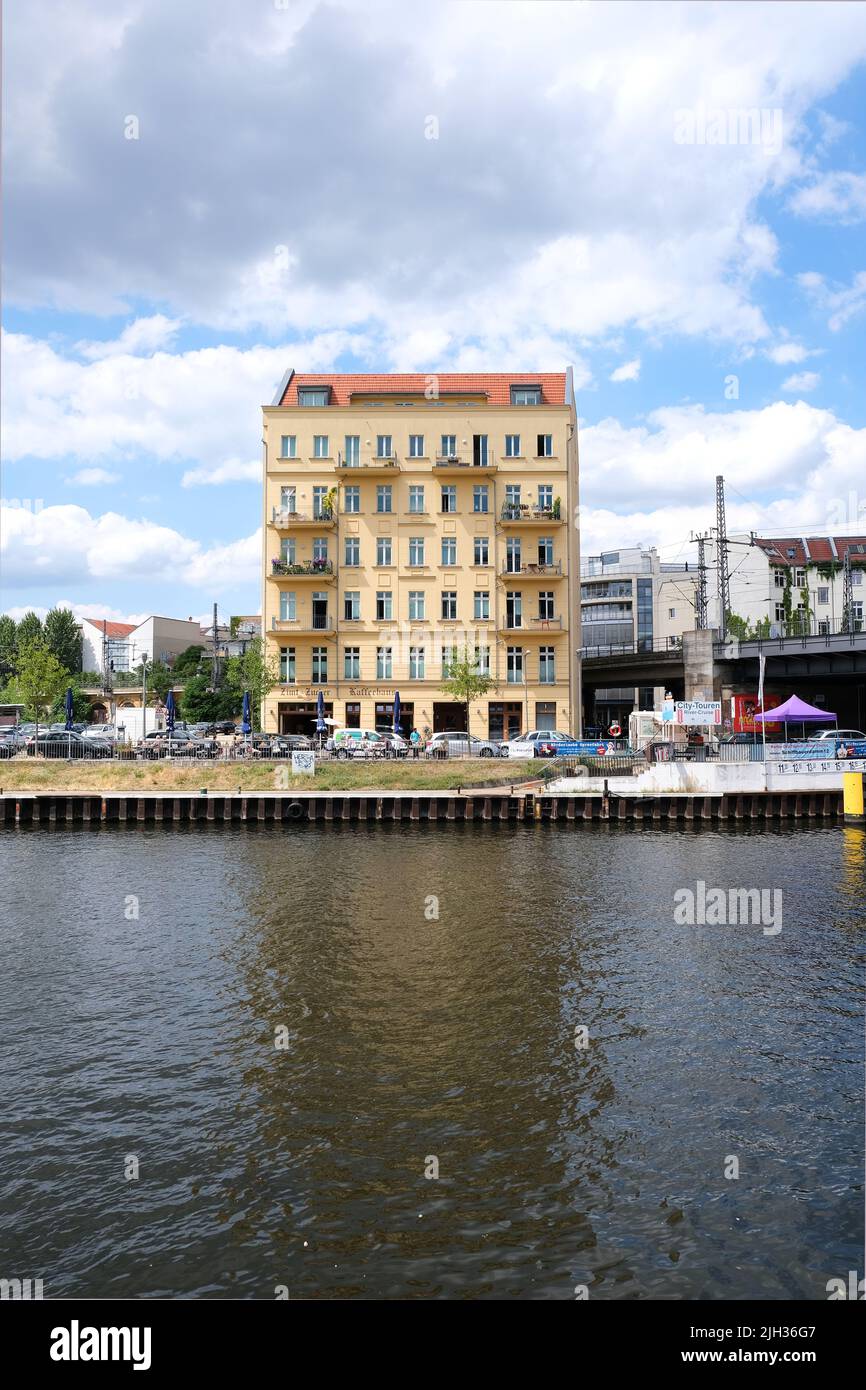Berlin, Germany, July 5, 2022, view over the river Spree to a single old building at Schiffbauerdamm Stock Photo