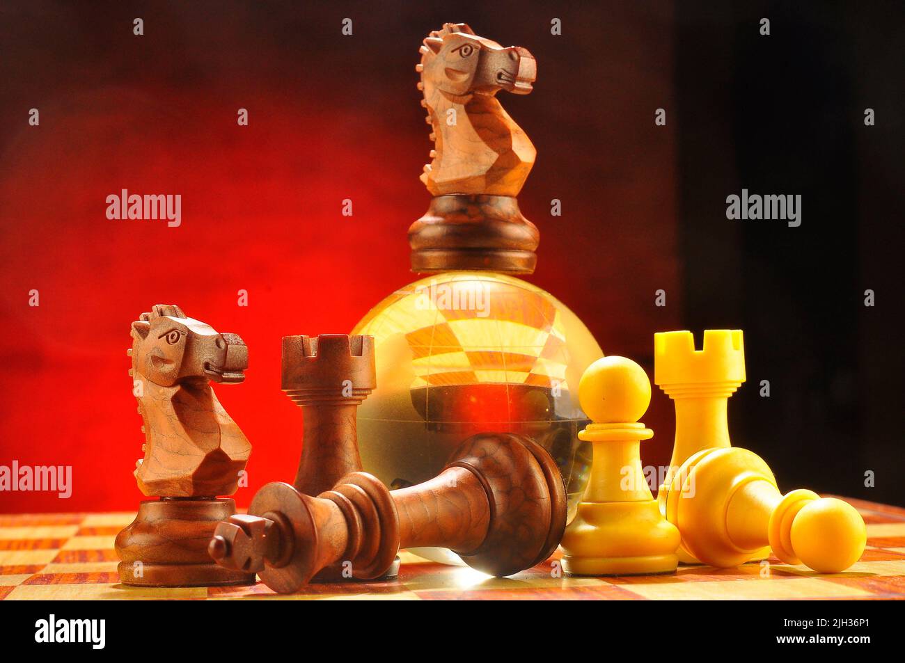 Wooden pieces of chess game on the chessboard Stock Photo Alamy