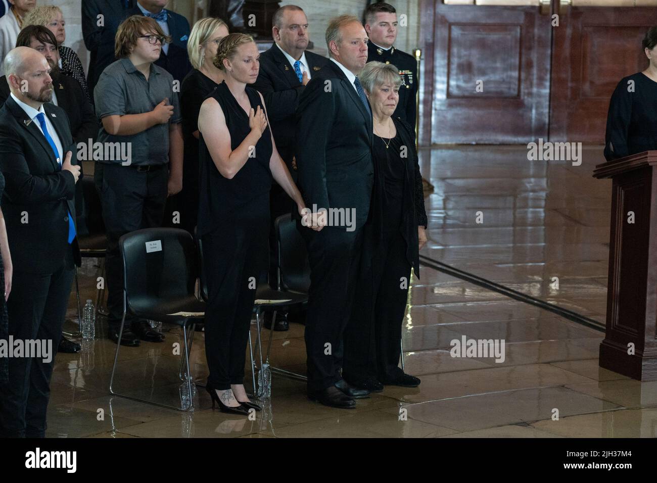 Kim Graham, Tom Graham, and Tracy Ross, the daughter of Marine Chief Warrant Officer 4 Hershel Woodrow “Woody” Williams, the last surviving World War II Medal of Honor recipient, react as his casket lays in honor in the Rotunda of the US Capitol, in Washington, DC, USA, 14 July 2022. The Marine Corps veteran, who died June 29th, was awarded the nation's highest award for his actions on Iwo Jima.Credit: Eric Lee/Pool via CNP /MediaPunch Stock Photo