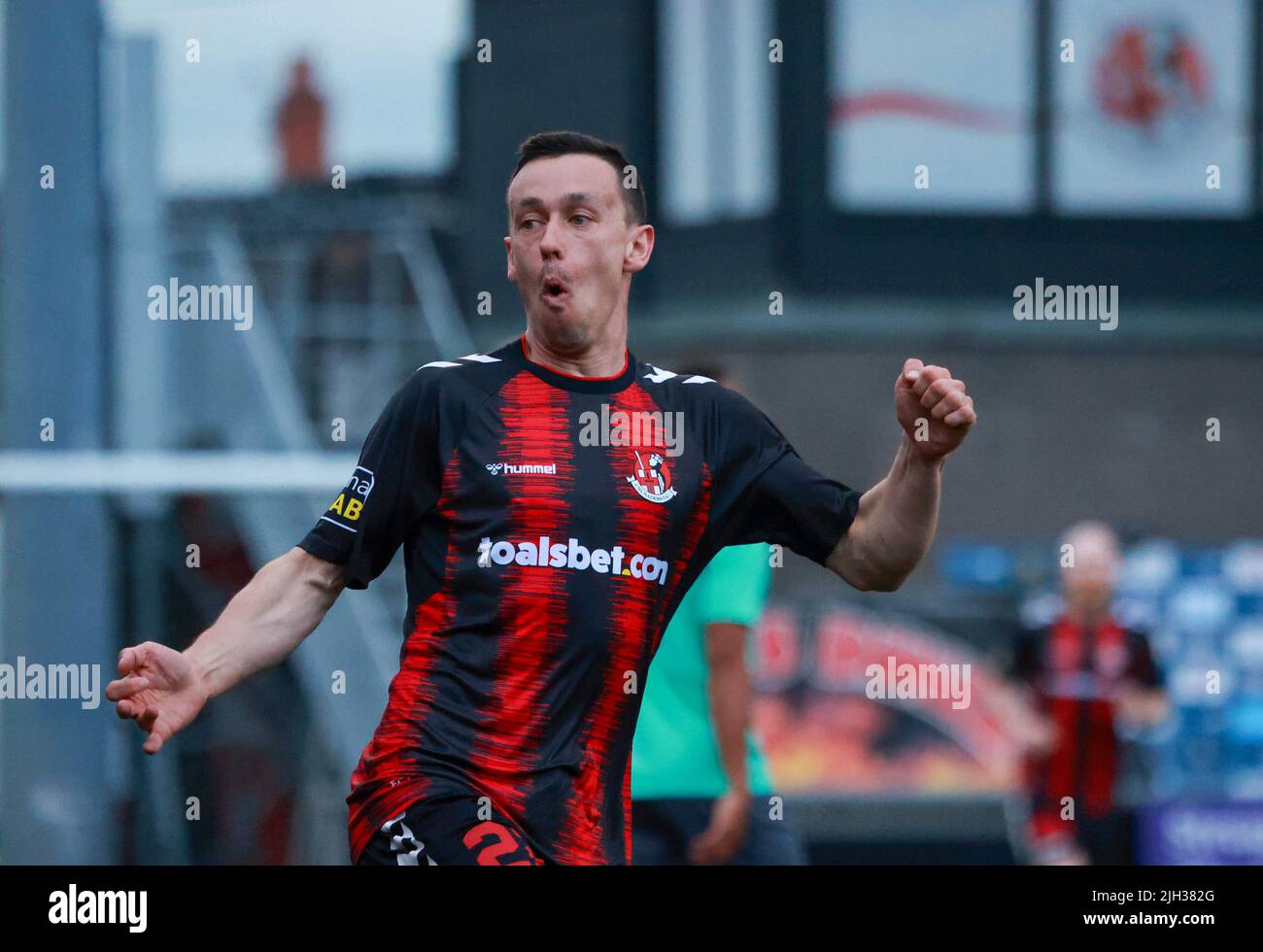 Seaview, Belfast, Northern Ireland, UK. 14 July 2022. UEFA Conference League First Qualifying Round  (second leg) – Crusaders v Magpies. Action from tonight's game at Seaview (Crusaders in red/black). Paul Heatley (22) scoring and celebrating the opening goal. Credit: CAZIMB/Alamy Live News. Stock Photo