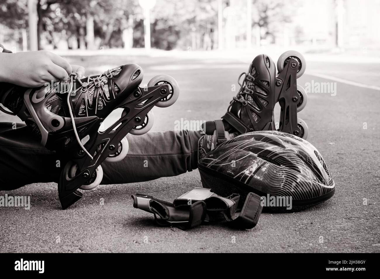 The boy puts on blue roller skates. Sport. Rollers Stock Photo Alamy