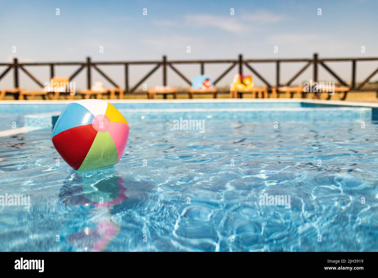 The ball floats on the water surface in the pool under the summer sun Stock Photo Alamy