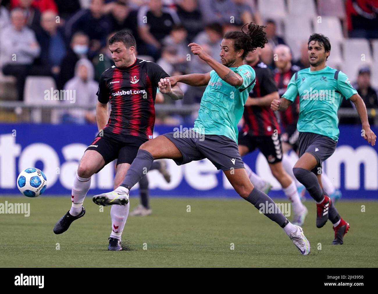 Crusaders’ Philip Lowry battles with Magpies’ Daniel Bent during the UEFA Europa Conference League First Qualifying Round second leg match at Seaview, Belfast. Picture date: Thursday July 14, 2022. Stock Photo