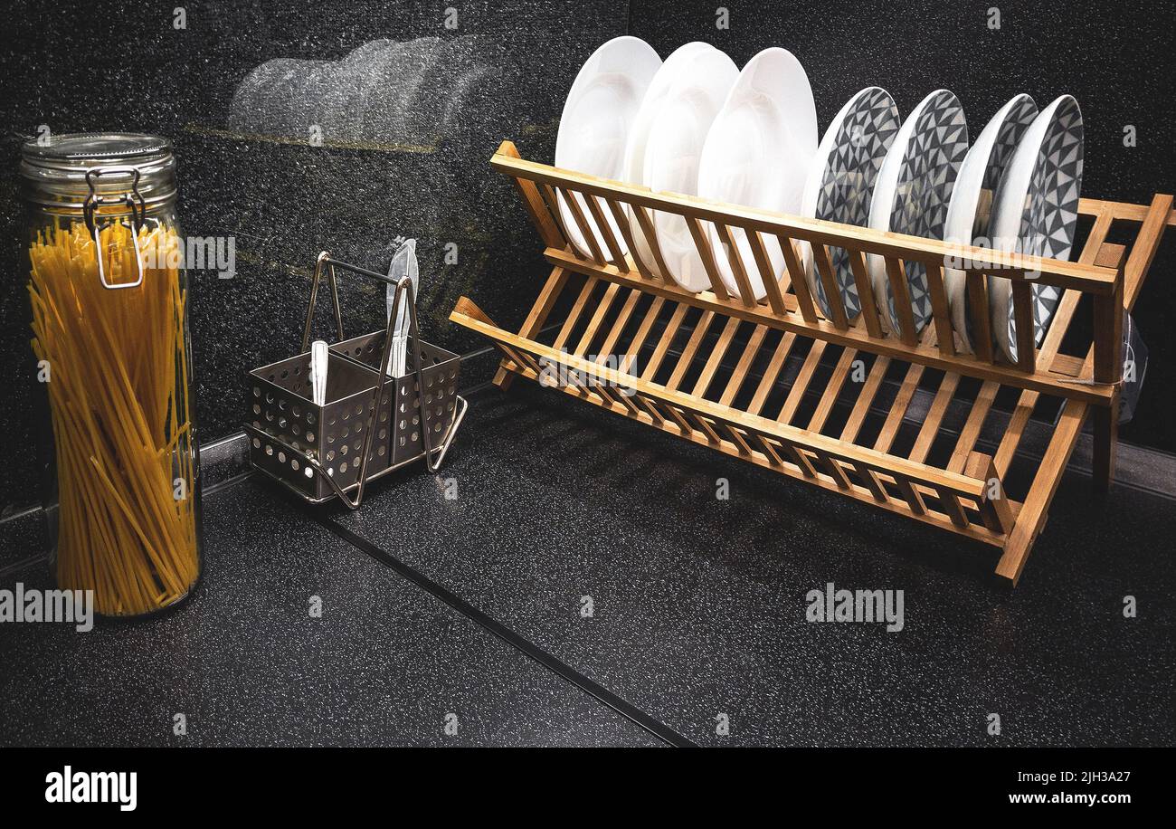 utensils on black angular kitchen top Stock Photo