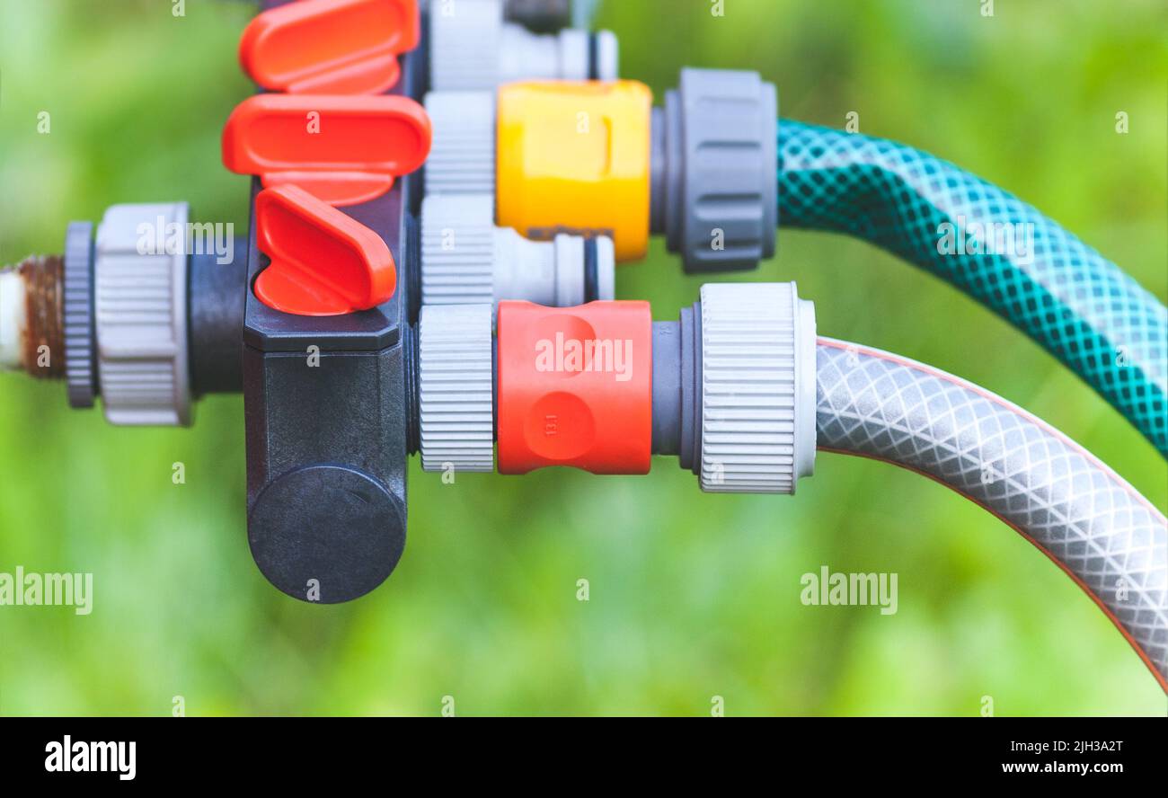plastic multi-channel supply water fitting for garden hoses Stock Photo