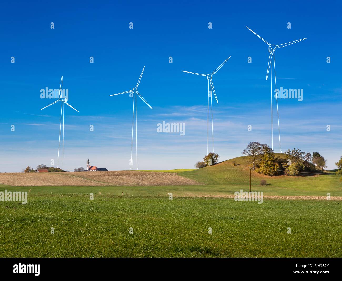 Projected Windmills in rural landscape with church tower. Outlines of windmills composited into a landscape image to show the optical impact of erecti Stock Photo