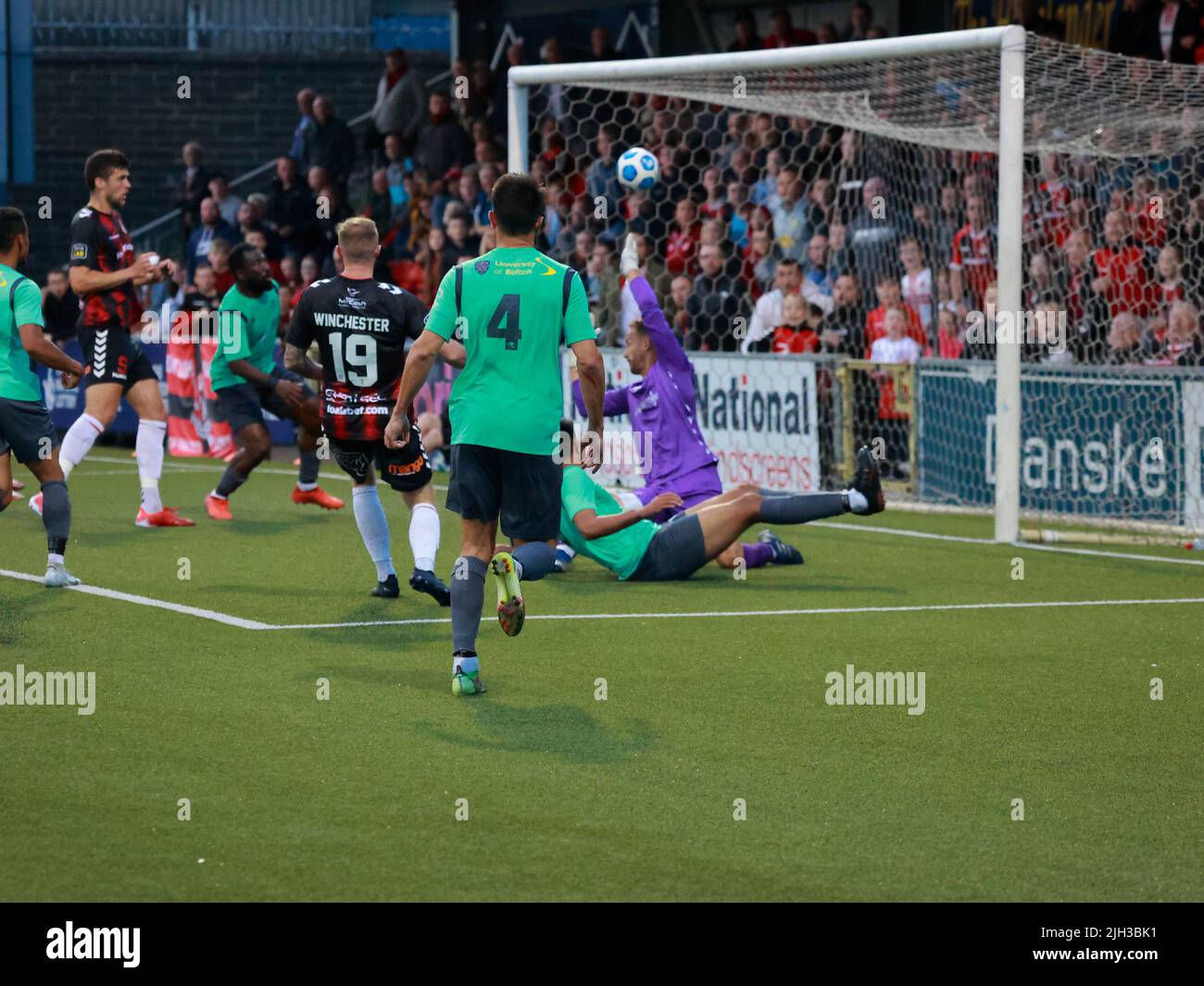 Seaview, Belfast, Northern Ireland, UK. 14 July 2022. UEFA Conference League First Qualifying Round  (second leg) – Crusaders v Magpies. Action from tonight's game at Seaview (Crusaders in red/black). Substitute Jude Winchester (19) levels the tie for Crusaders.Credit: CAZIMB/Alamy Live News. Stock Photo