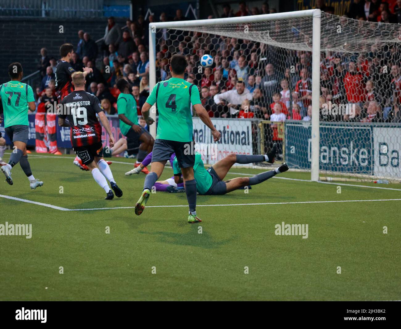 Seaview, Belfast, Northern Ireland, UK. 14 July 2022. UEFA Conference League First Qualifying Round  (second leg) – Crusaders v Magpies. Action from tonight's game at Seaview (Crusaders in red/black). Substitute Jude Winchester (19) levels the tie for Crusaders.Credit: CAZIMB/Alamy Live News. Stock Photo
