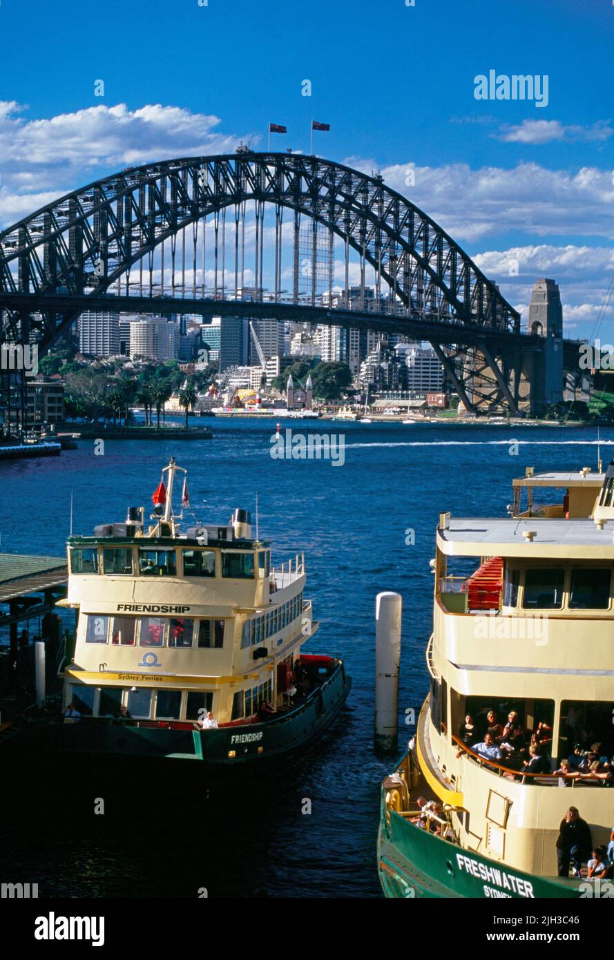 Sydney NSW Australia Ferries in Circular Quay Harbour Bridge Behind Stock Photo