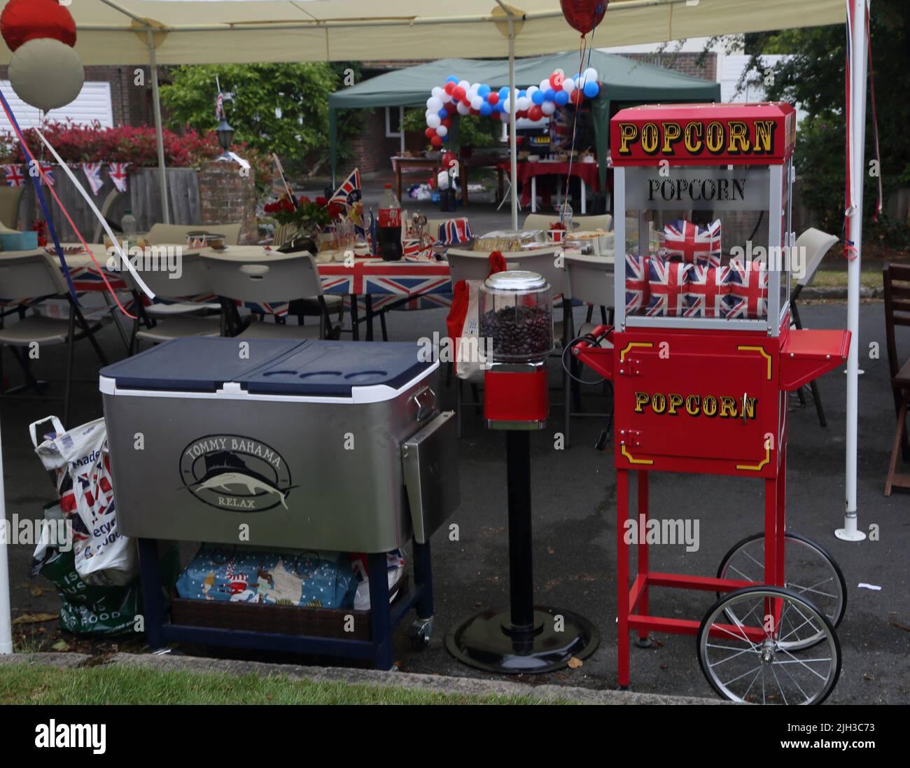 Popcorn Cart And Aniseed ball Machine at Street Party Celebrating Queen Elizabeth II Platinum Jubilee Surrey England Stock Photo