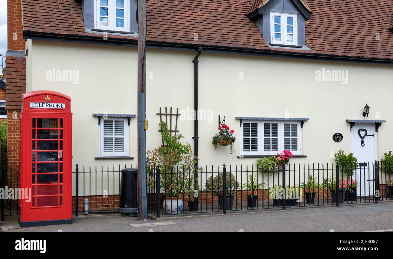 Modern cottage and Red Telephone box Stock Photo