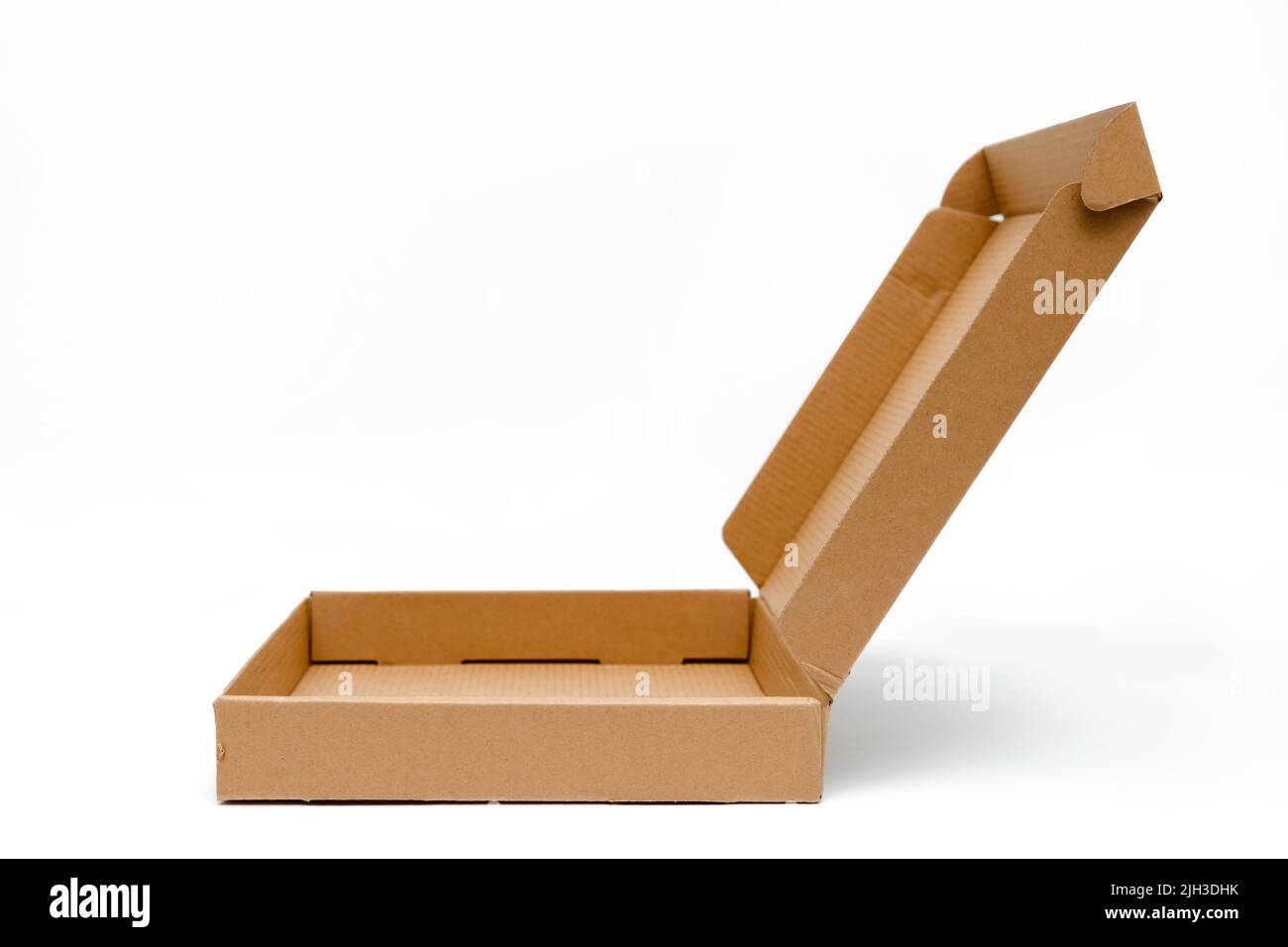 low cardboard box with hinged lid isolated on white background