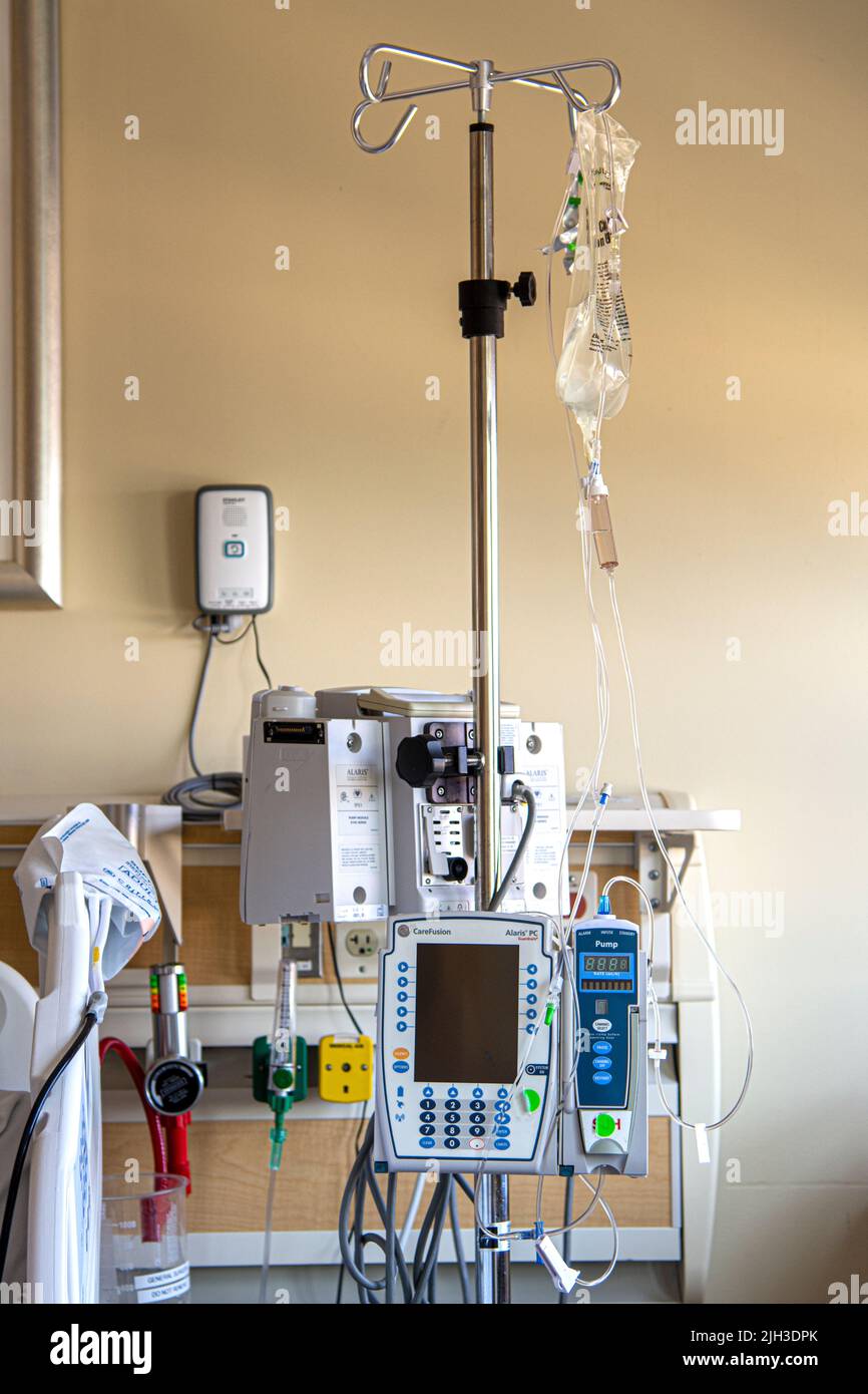 In the hospital: IV pole, infusion and fluids bags, cardiovascular  telemetry monitor Stock Photo - Alamy