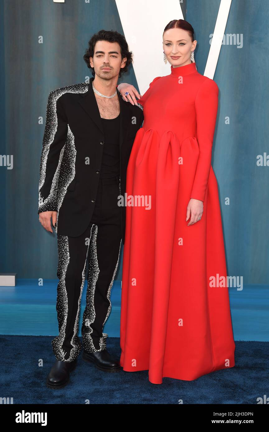 Sophie Turner at Emmys in pink Louis Vuitton as Joe Jonas calls