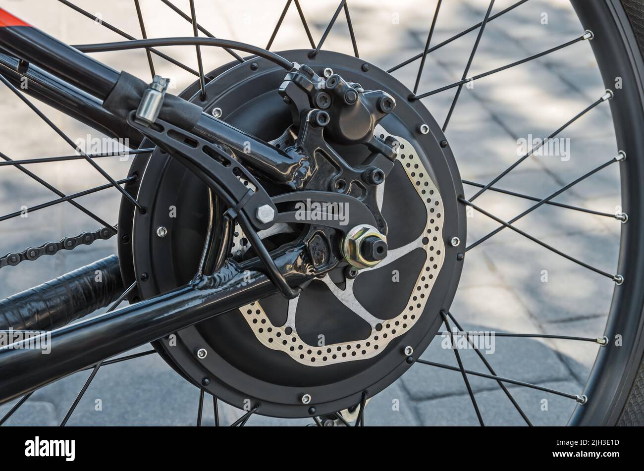 Rear bicycle motor wheel integrated into mountain bike closeup from