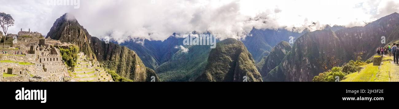Panoramic view of Machu Piccu on cloudy day early. High angle view. Natural and historical background with copy space.Machu Picchu is an Incan citadel Stock Photo
