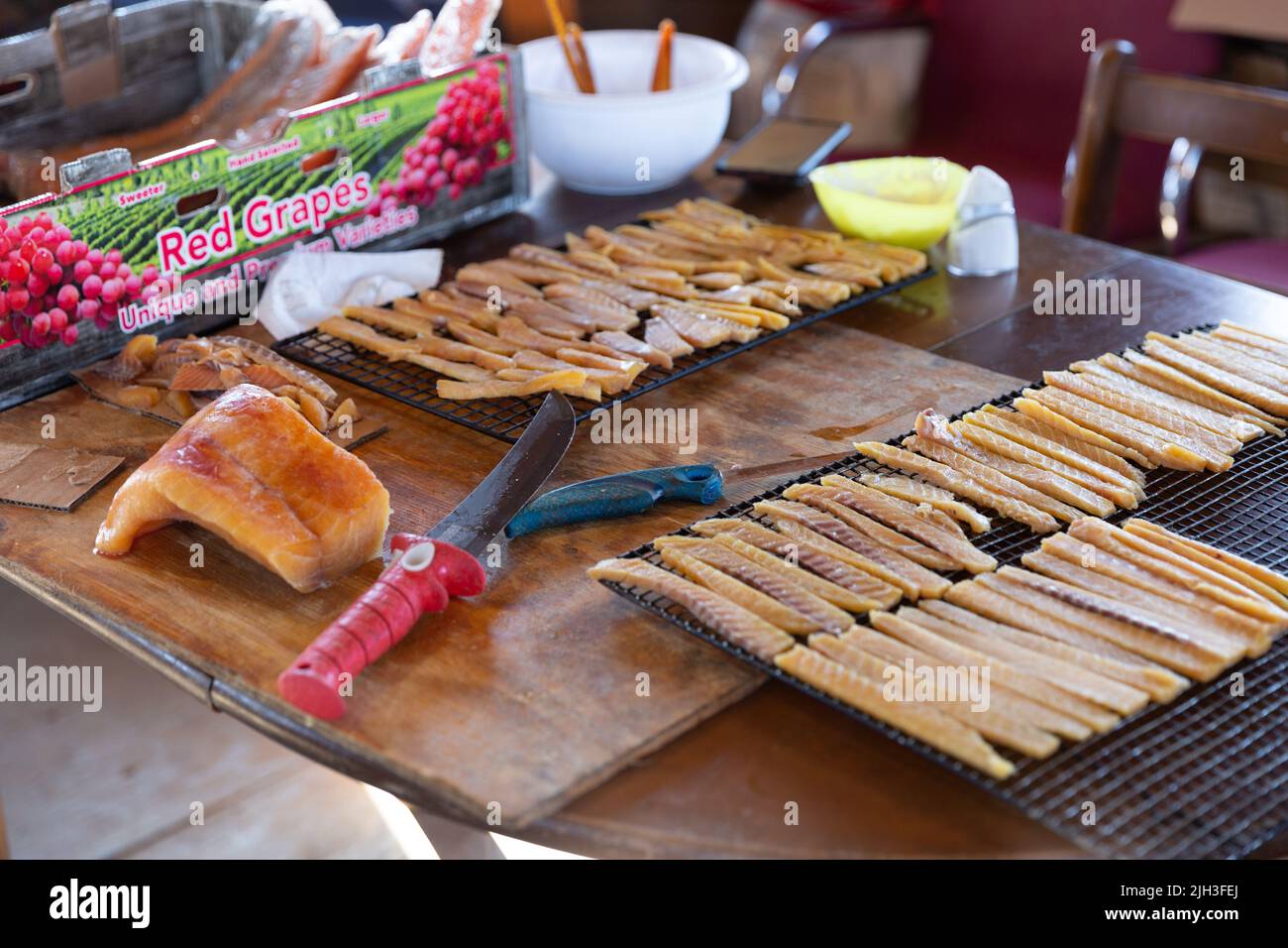 Preparing Lake Trout fish strips, a traditional Indigenous country food, in  Deline, Northwest Territories, Canada. Stock Photo