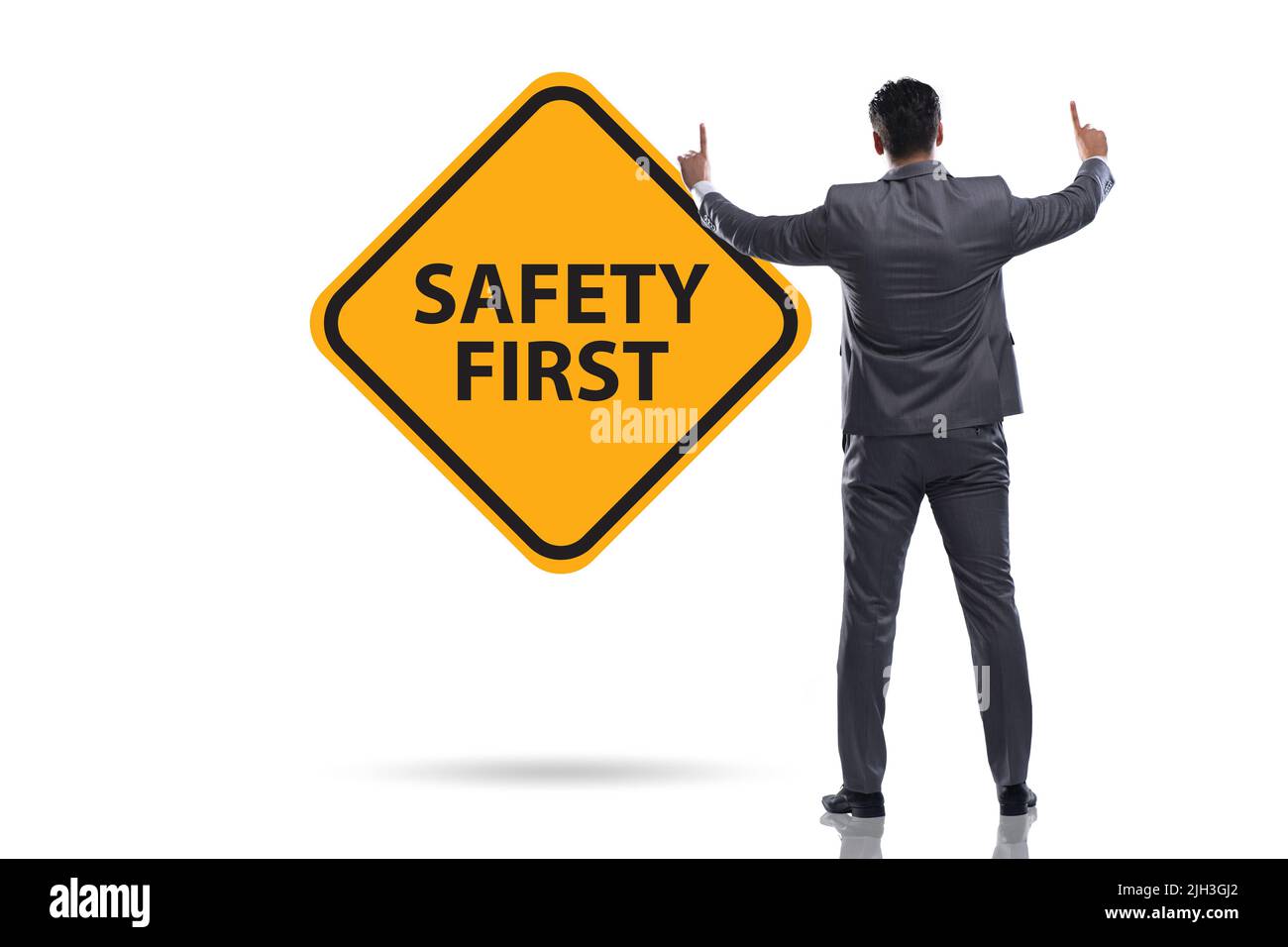Safety first concept with the businessman Stock Photo - Alamy