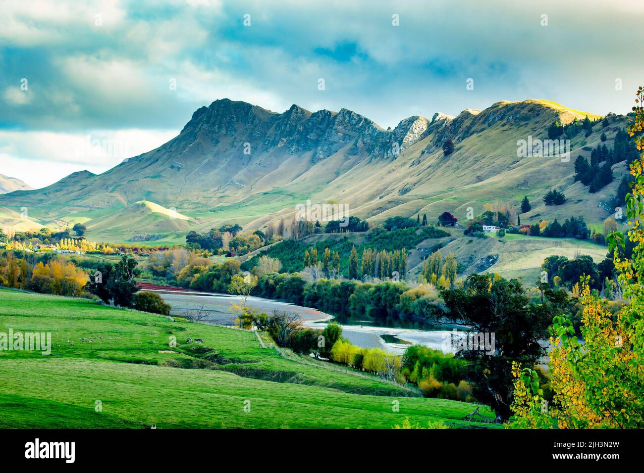 The sleepy meandering river flowing through the beauty in nature in the valley beneath the Mountain ridge at Te Mata Hawke's Bay Stock Photo