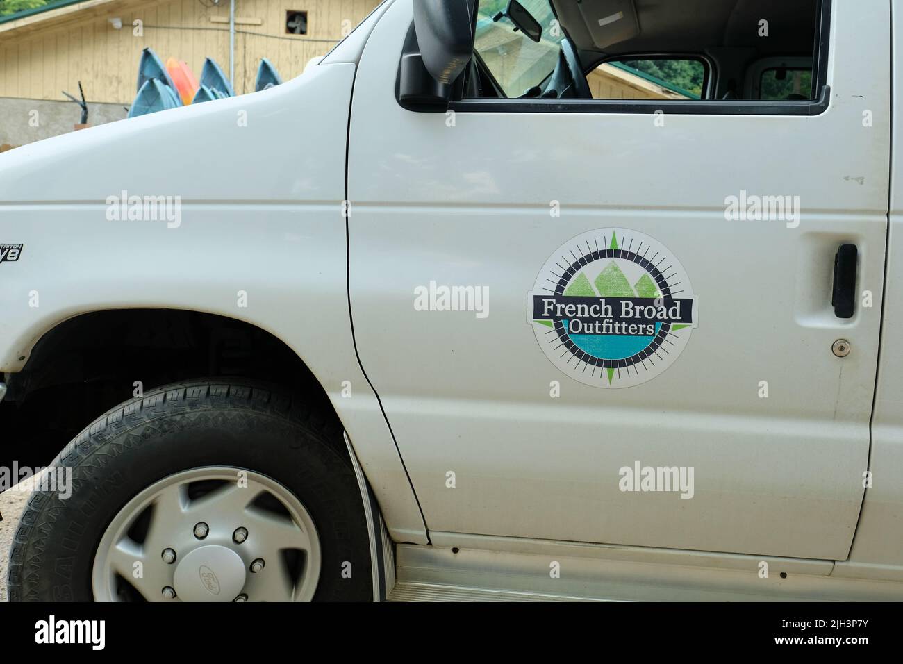 Van door with French Broad Outfitters logo; outdoor adventure company with kayaking, paddle boarding, and tube trips in Asheville, North Carolina. Stock Photo