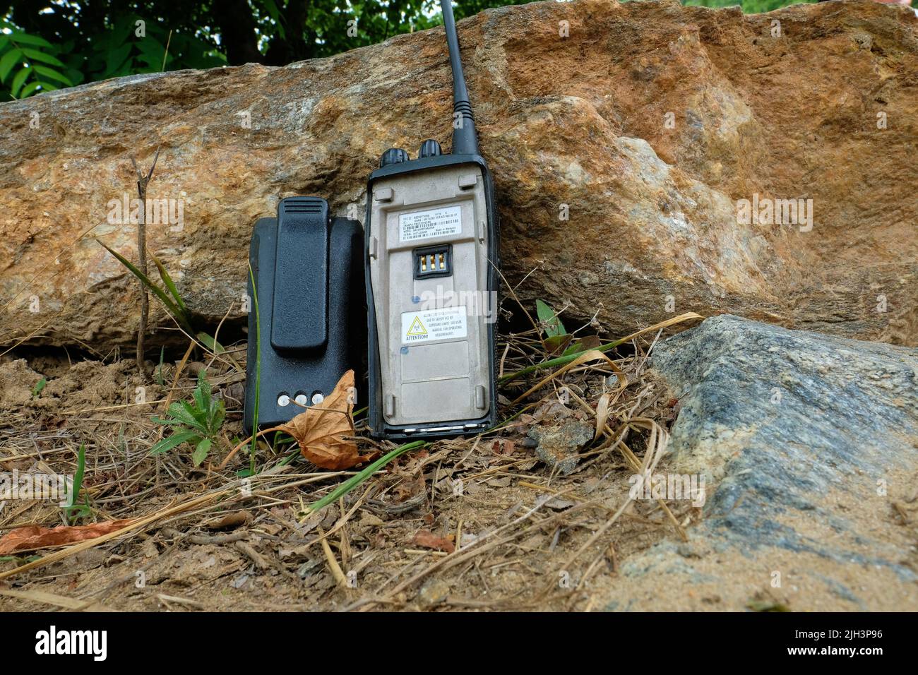 Discontinued Motorola PR400 UHF Portable Two Way Radio, 32 Channel, model AAH65RDF9AA3AN with removed battery, opened with exposed chassis. Stock Photo