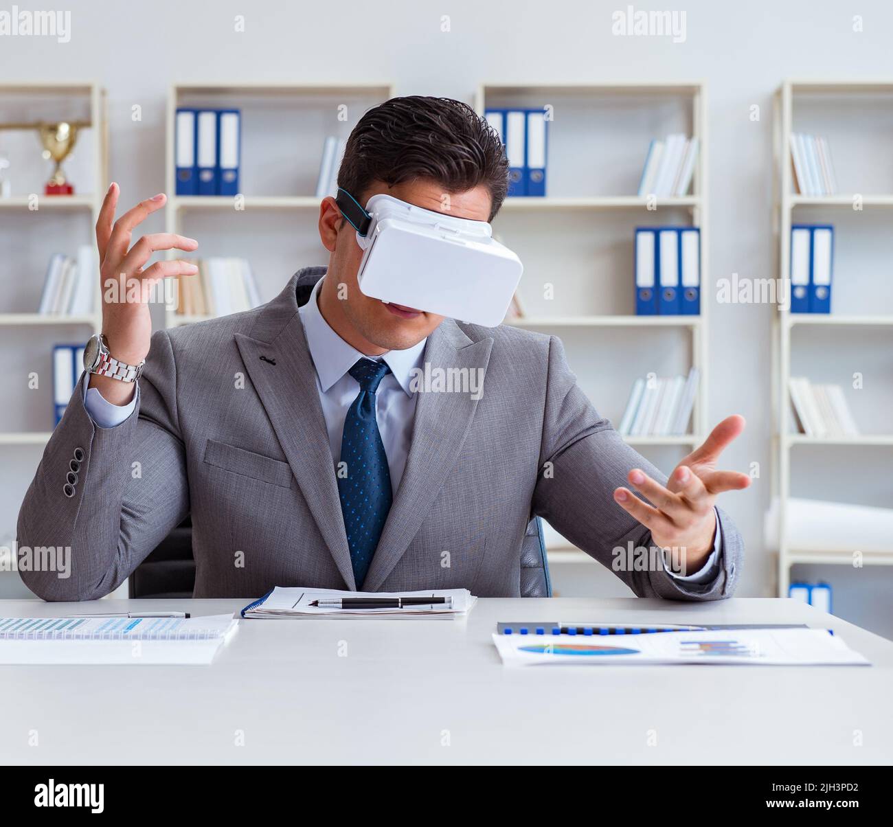 The businessman with virtual reality glasses in the office Stock Photo ...