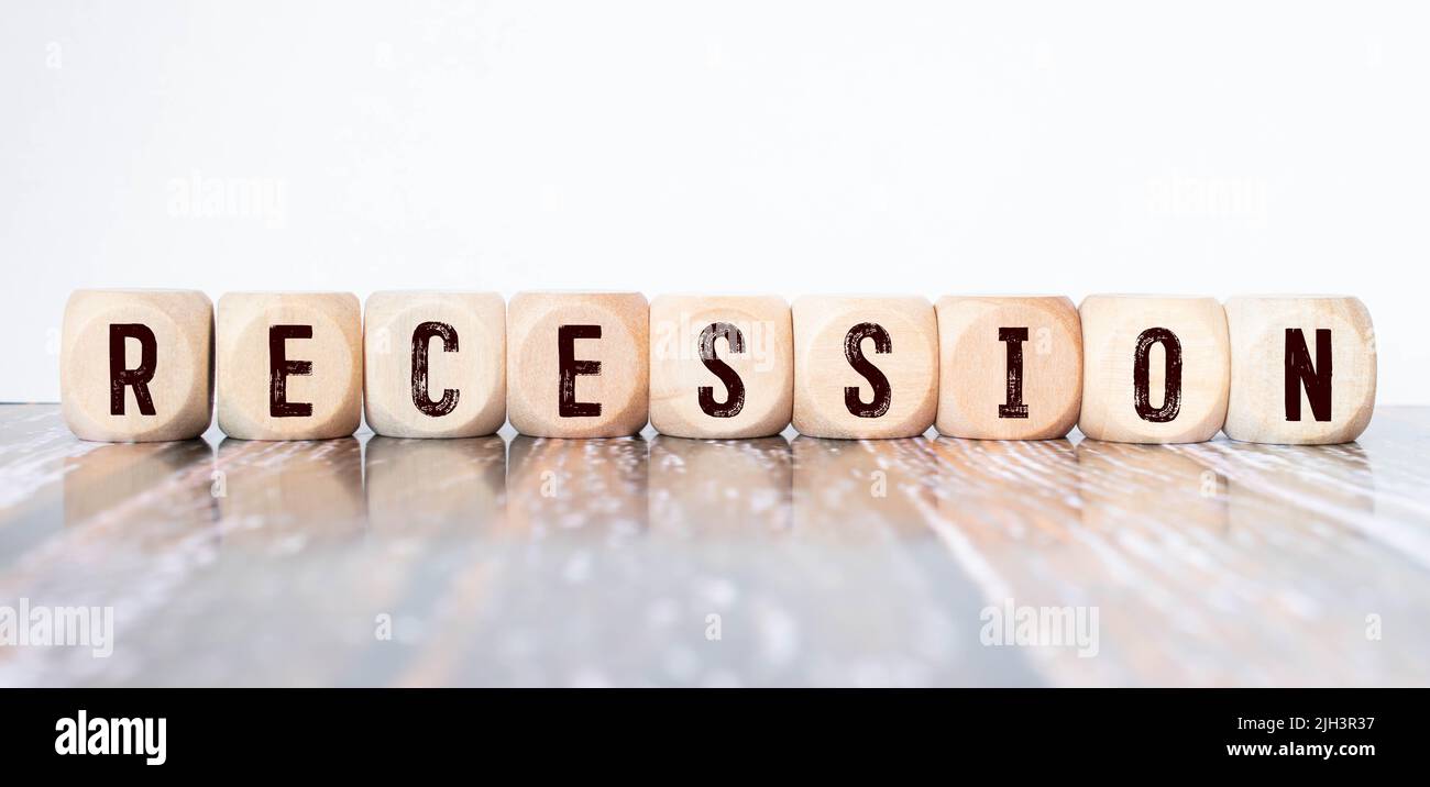 Recession word on wooden block isolated on gray background Stock Photo