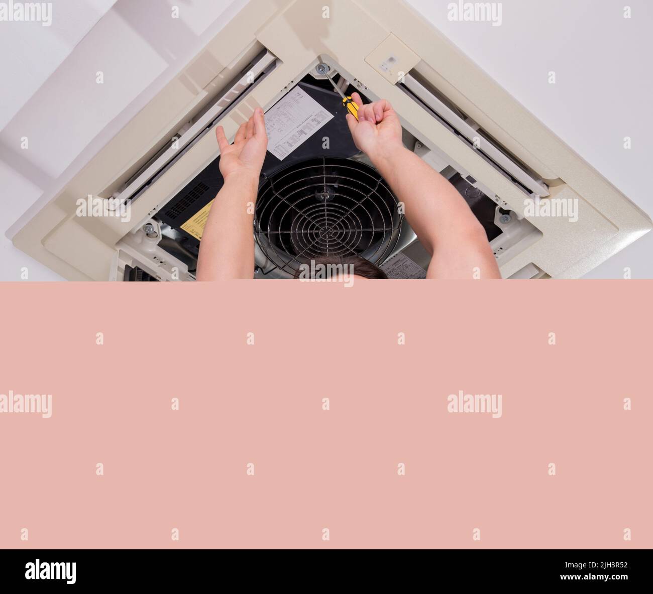 The worker repairing ceiling air conditioning unit Stock Photo Alamy