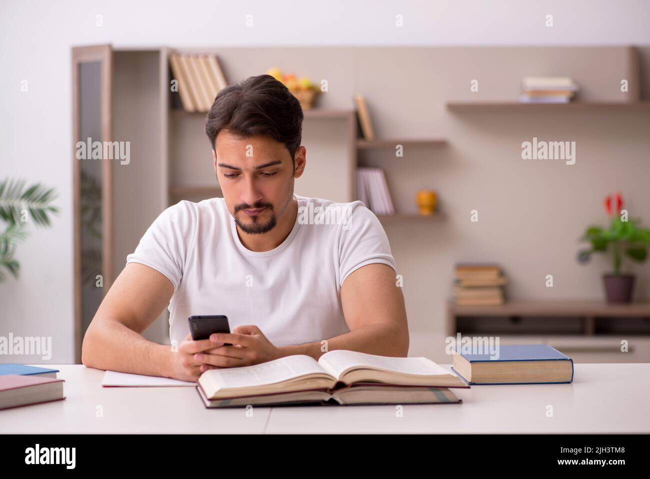 Young student studying at home during pandemic Stock Photo - Alamy