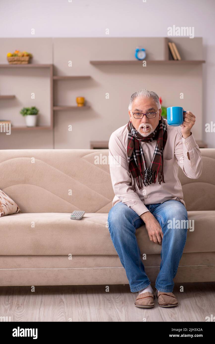 Sick old man coughing sitting hi-res stock photography and images - Alamy