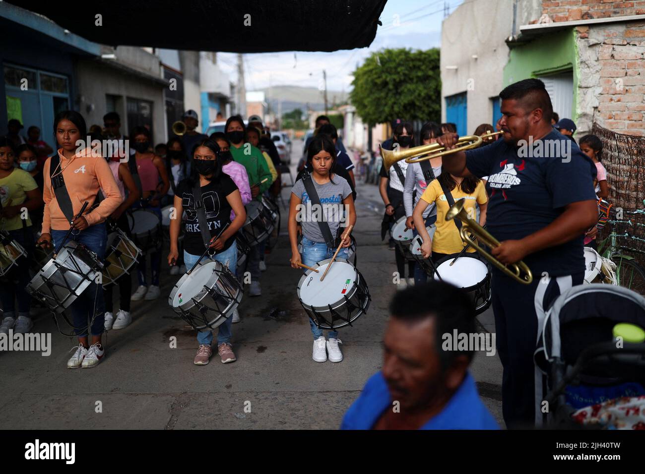 A music band plays music during the wake of late migrant Jose Lopez, 34, after being repatriated from San Antonio, Texas, U.S., at his family's home in Celaya, in Guanajuato state, Mexico July 14, 2022. REUTERS/Edgard Garrido Stock Photo