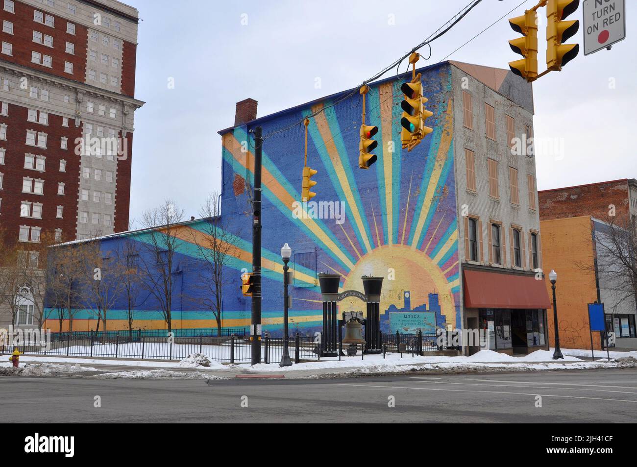 Liberty Bell Corner Park and Utica Sunburst Mural at the intersection of Genesee Street and Lafayette Street in downtown Utica, New York State NY, USA Stock Photo
