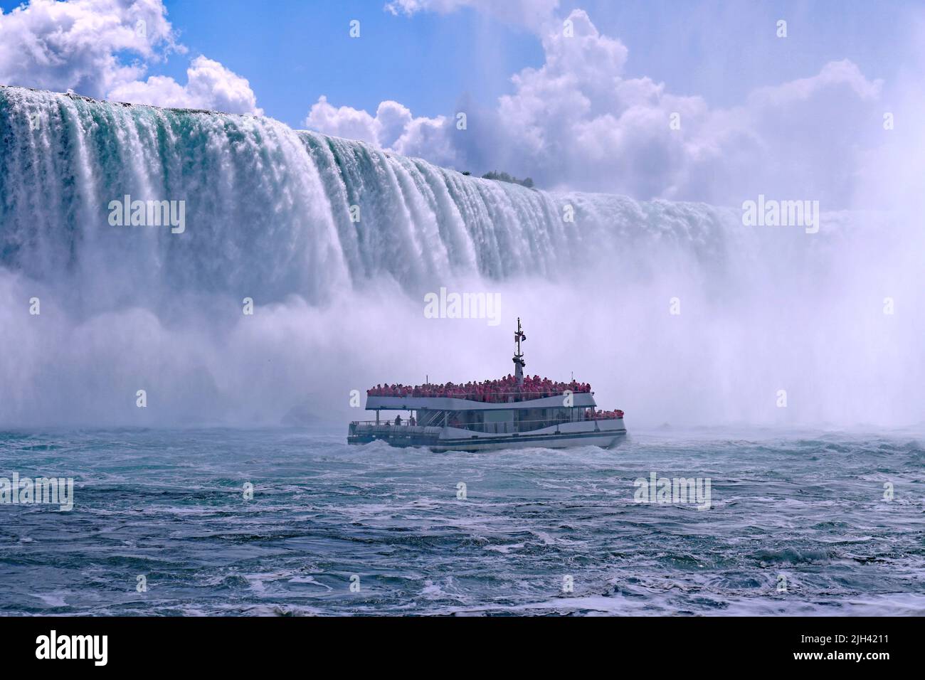 Niagara Falls tour boat is shrouded in mist as it approaches the