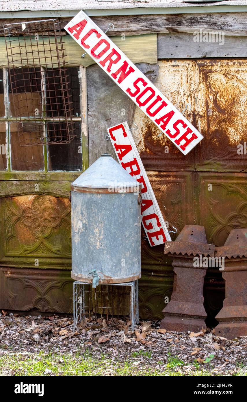 old signs, tin panels and antiques are junk yard treasures at a fun place in Michigan USA Stock Photo