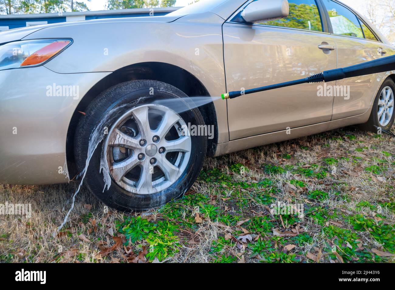 Sprayer With Water During Car Wheel Washing Stock Photo Alamy
