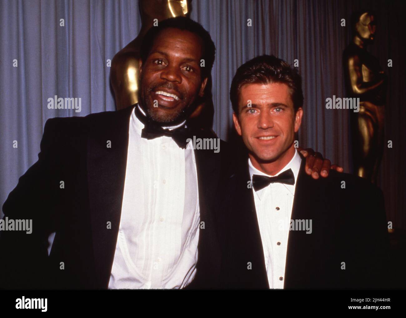 Mel Gibson with Danny Glover at the 60th Annual Academy Awards April 11 ...