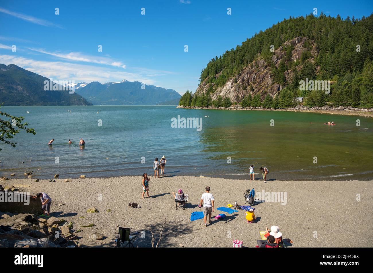 Summer crowds enjoy the beach at Porteau Cove Provincial Park, along Howe Sound near Squamish BC, Canada. Stock Photo