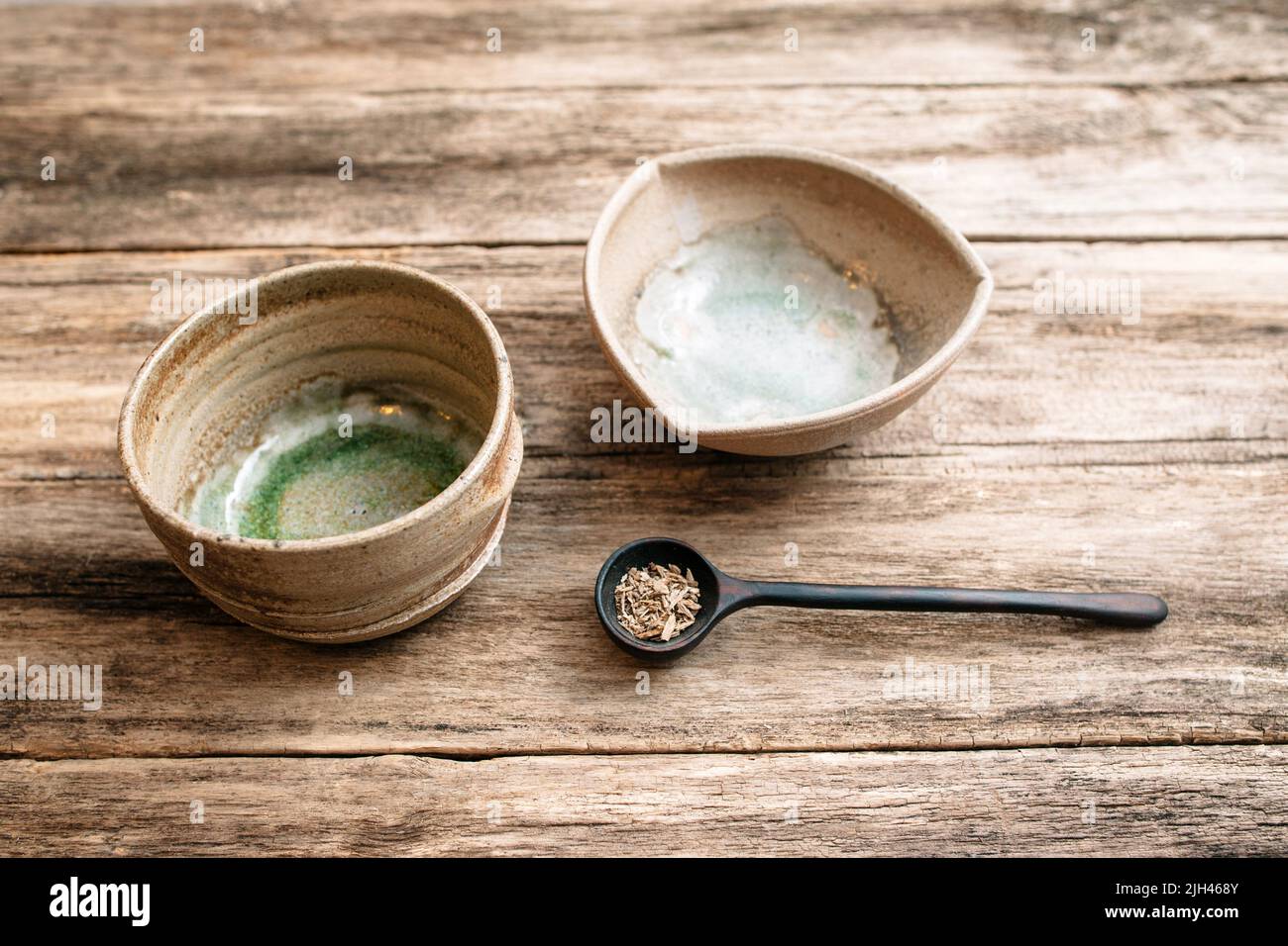 Empty clay bowls and spoon top view Stock Photo - Alamy
