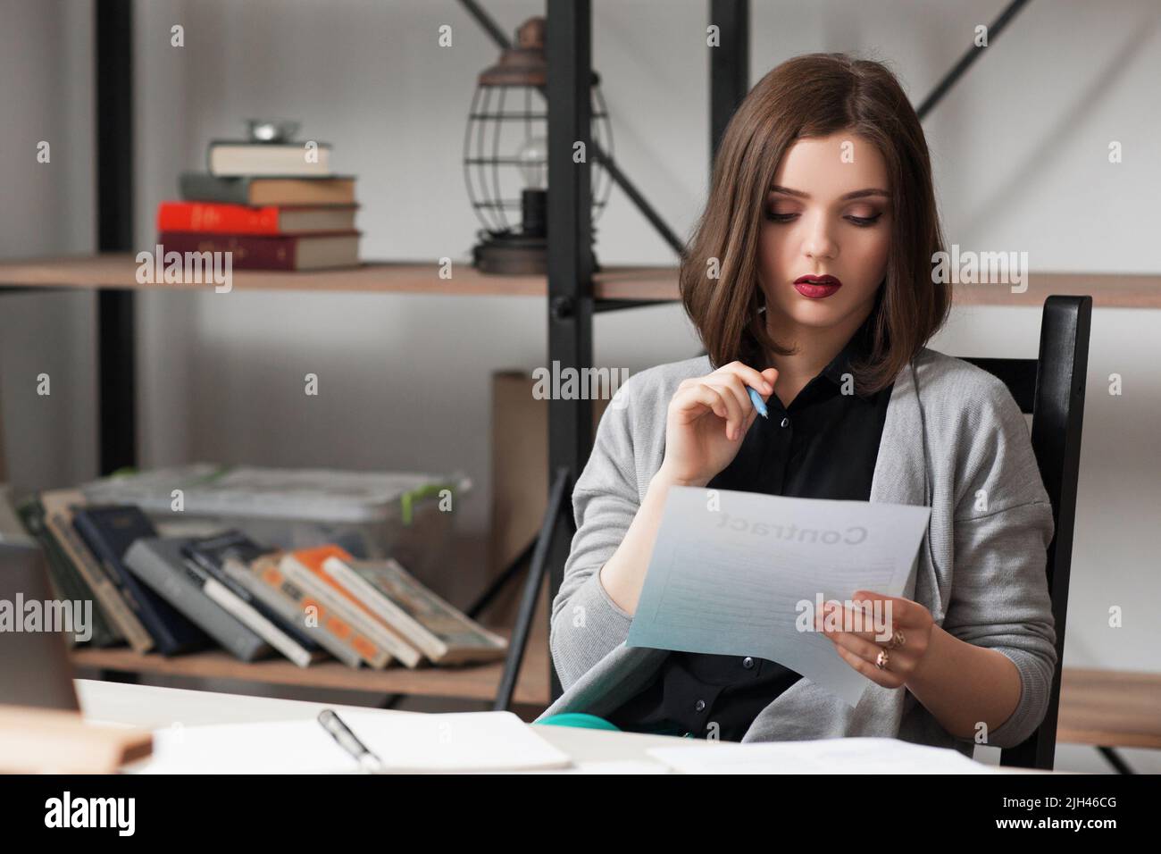 Young businesswoman working on business papers Stock Photo
