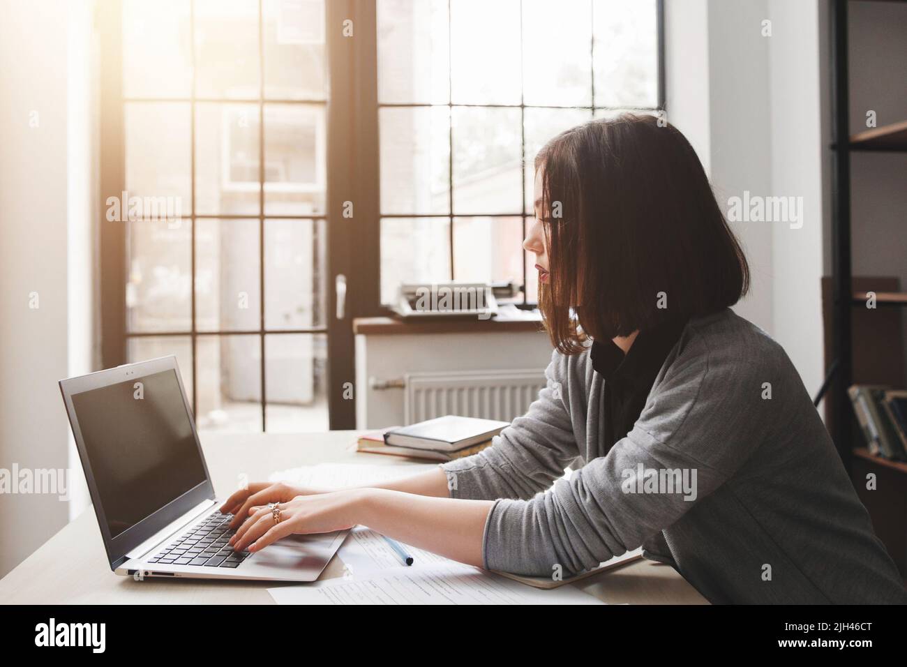 Young female blogger working at home Stock Photo