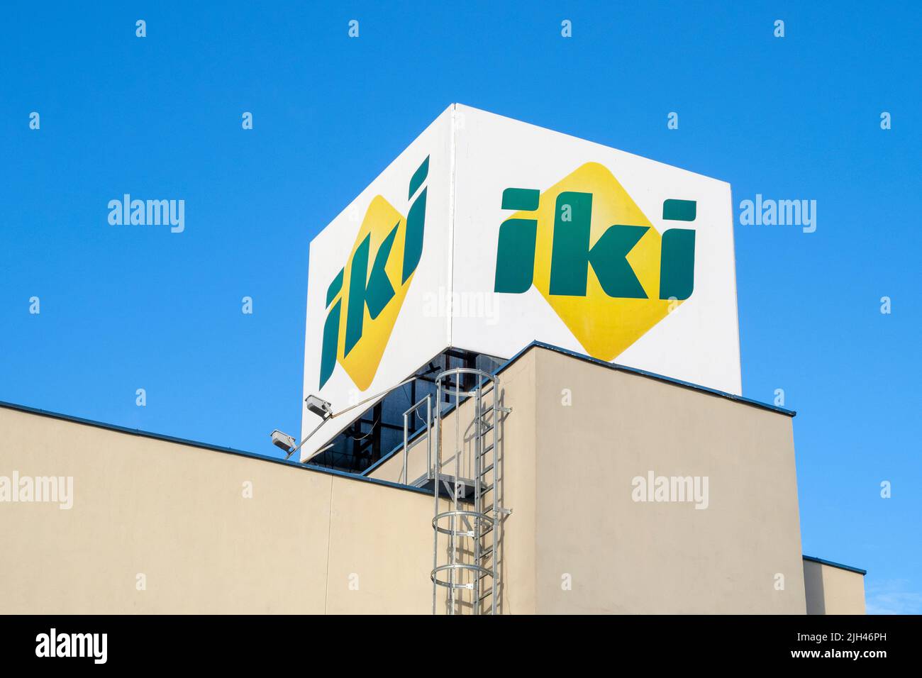 VILNIUS - JUL 07: IKI big logotype of grocery store in Vilnius, July 07. 2022 in Lithuania. Stock Photo