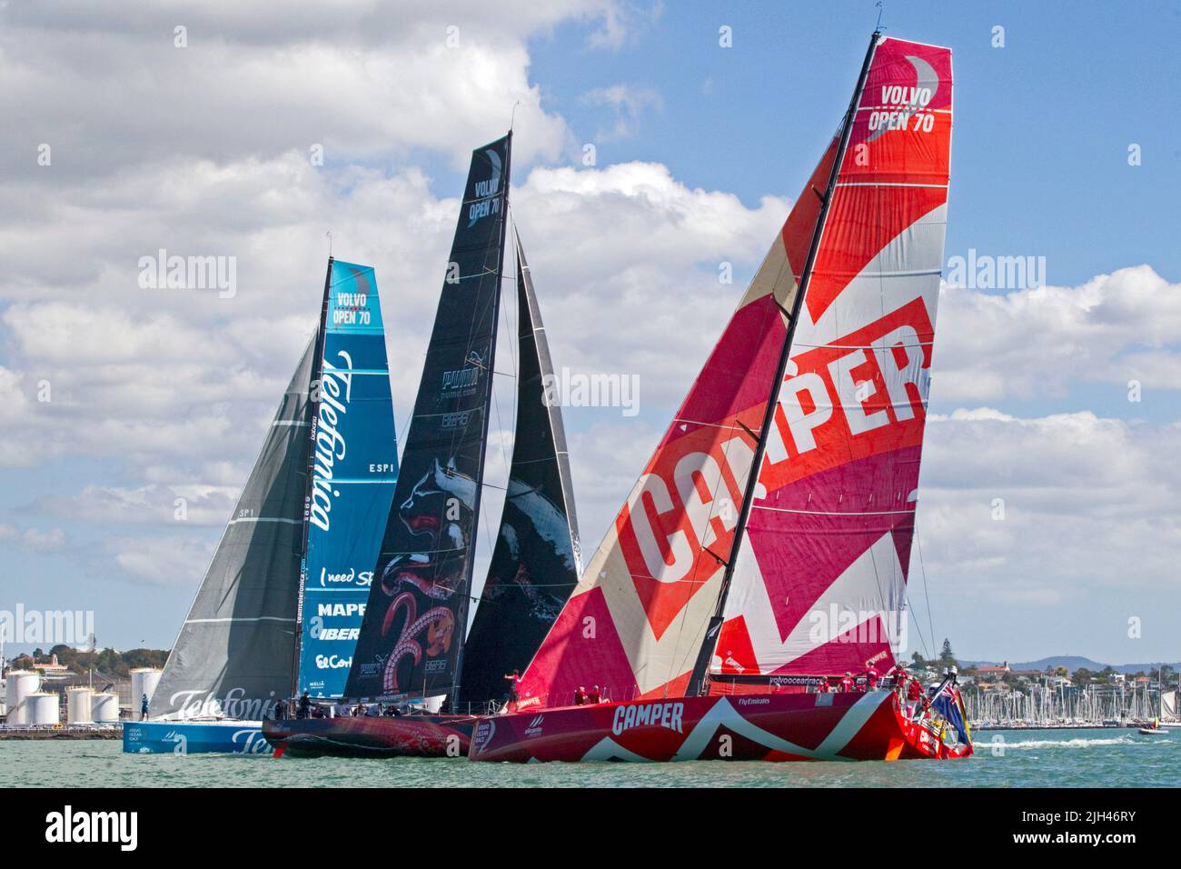 Team Telefonica, left, Puma Ocean Racing and Camper with Emirates Team New Zealand take part in the Pro-Am Race as part of the in-port activities Stock Photo
