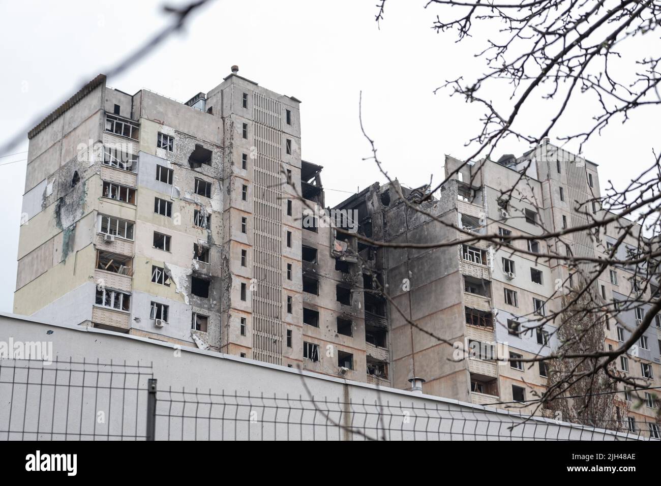 War in Ukraine 2022. Destroyed, bombed and burned residential building after Russian missiles in Kharkiv Ukraine. Russian aggression, conflict Stock Photo