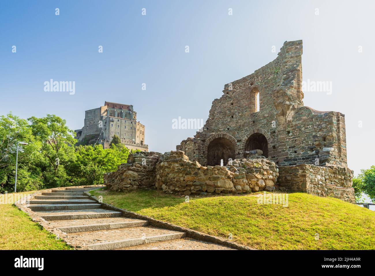 Ruins of Sepolcro dei Monaci on the way to Sacra di San Michele, medieval abbey on top of a hill Stock Photo
