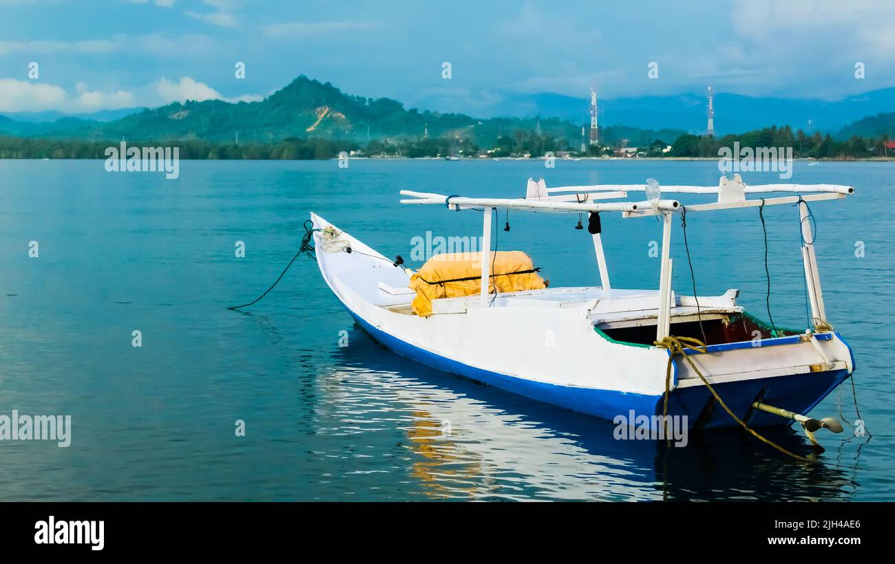 A motorboat used by fishermen. Tropical landscape with motorboat ...
