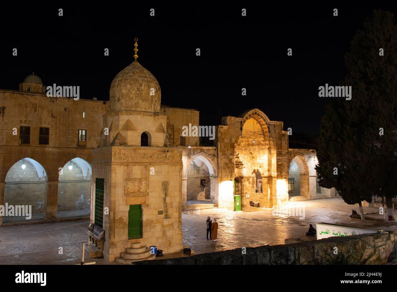 Fountain of Qaitbay and Cotton Merchants Gate or Bab al-Qattanin in Aqsa mosque. Night time in muslim quarter of Jerusalem city Stock Photo