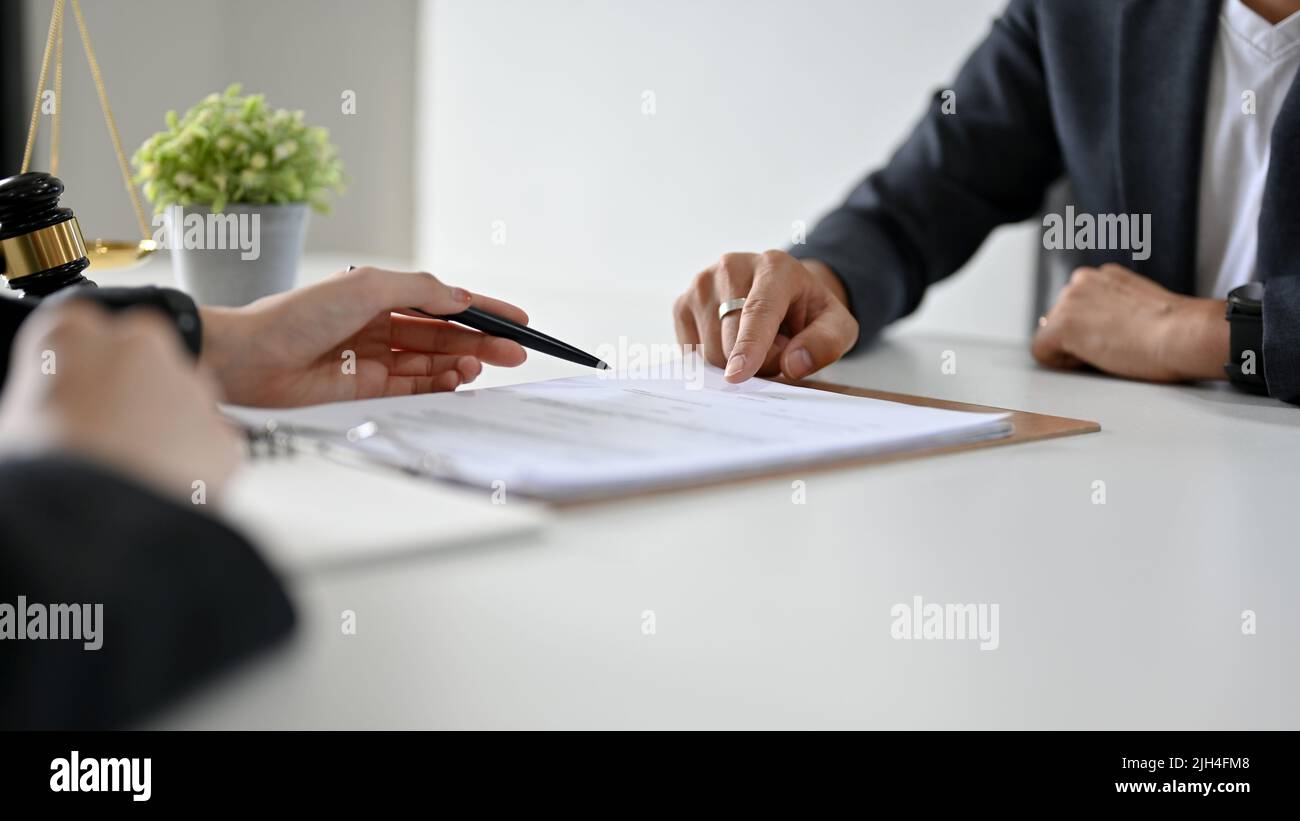 A professional female lawyer is having a formal meeting in the office ...